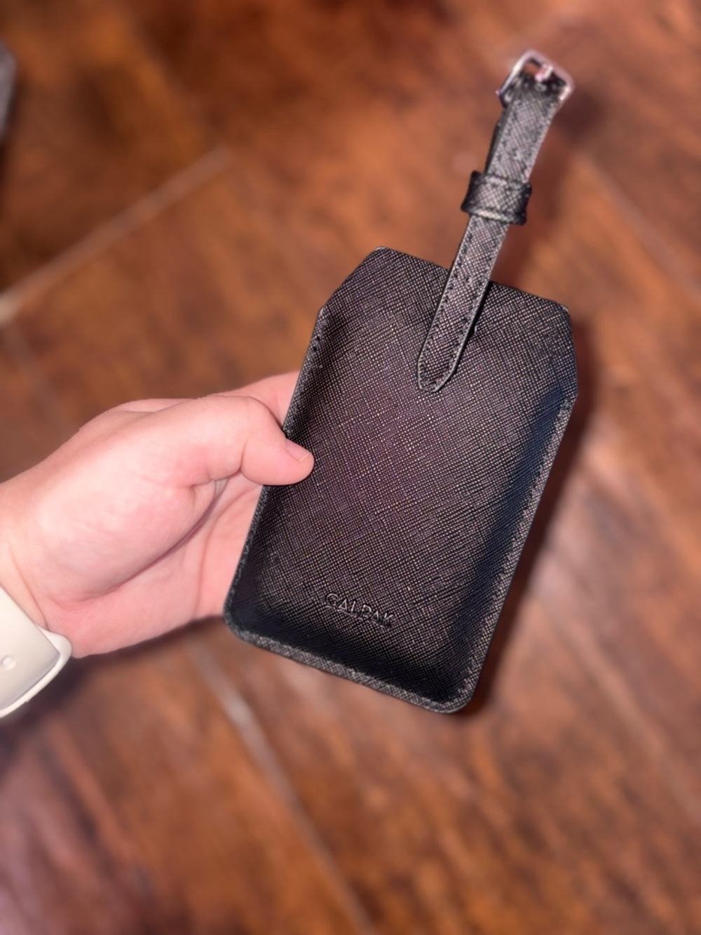 Calpak Black Textured Leather Luggage Tag with Strap & Portable Charger